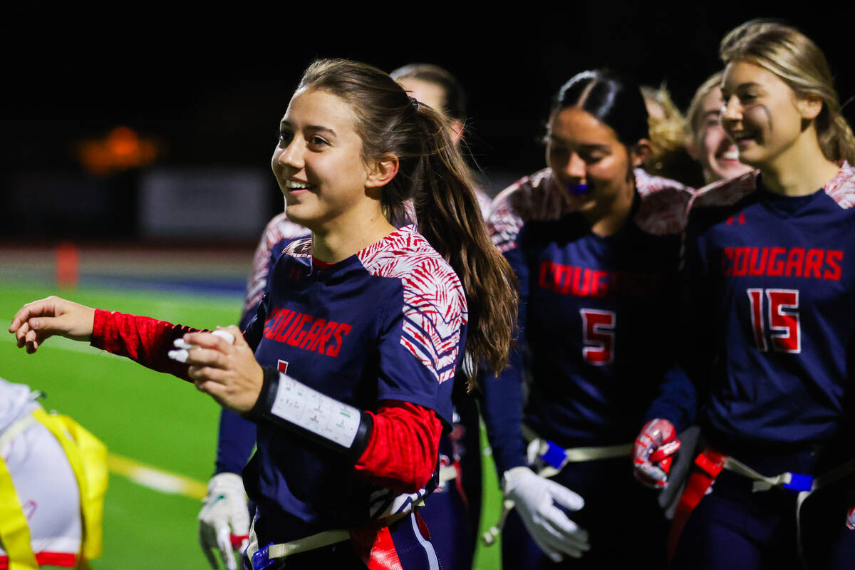 Coronado players celebrate their teammate Maci Joncich’s (1) touchdown during a flag foo ...