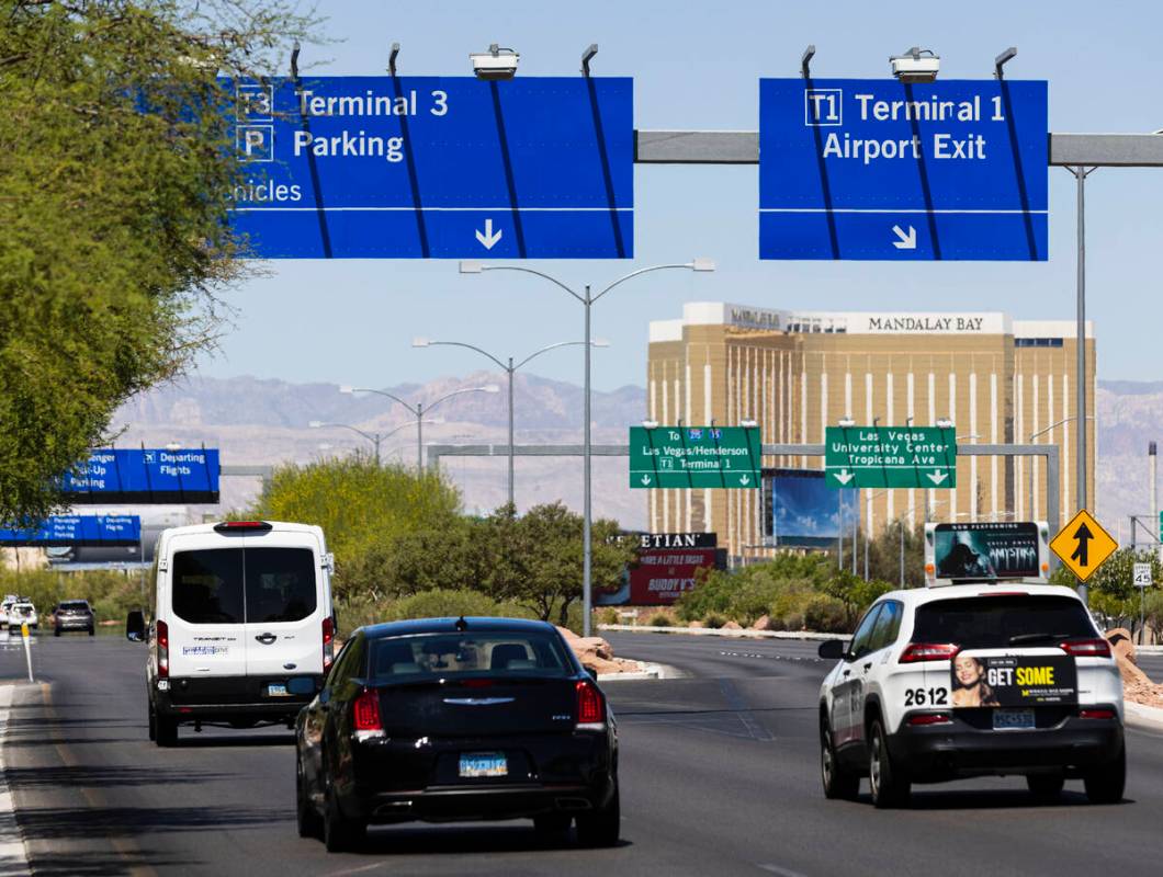 A sign directing traffic to Terminal 3 is posted at Harry Reid International Airport on Friday, ...