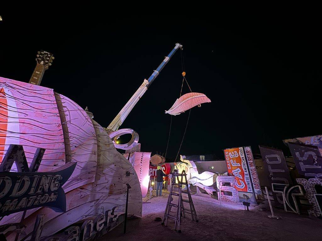 A large portion of a 1970s Flamingo Hotel & Casino sign is moved by crane on Tuesday, Jan. 30, ...