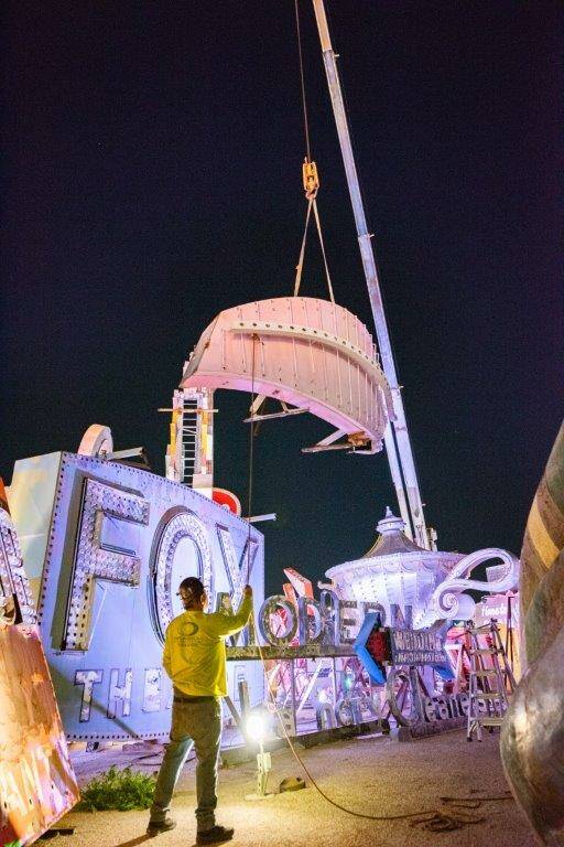 A large portion of a 1970s Flamingo Hotel & Casino sign is moved by crane on Tuesday, Jan. 30, ...