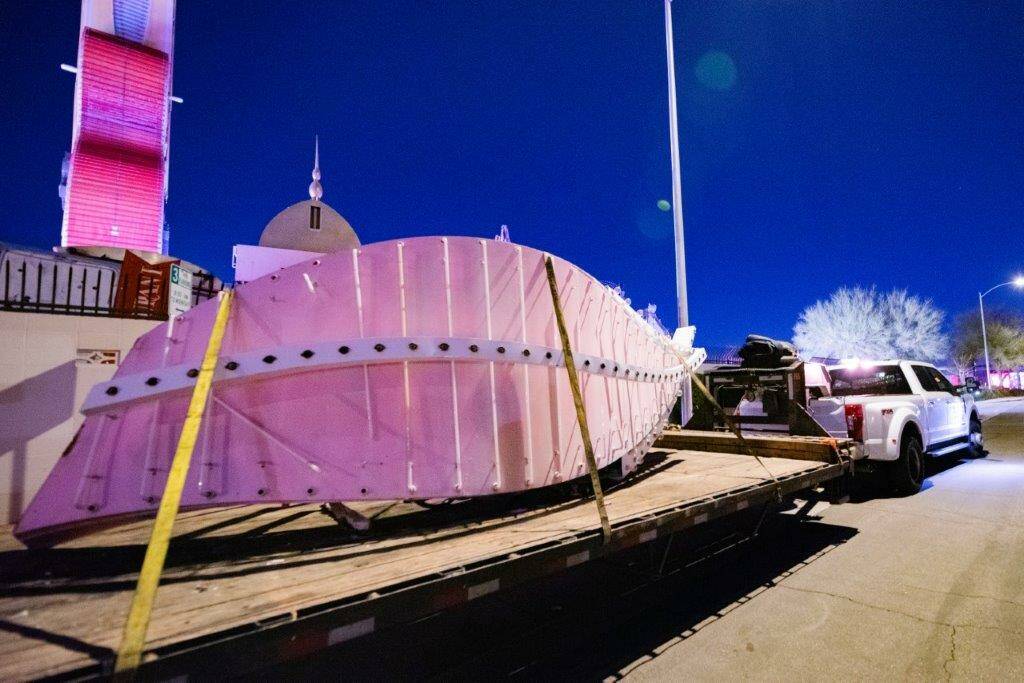 A large portion of a 1970s Flamingo Hotel & Casino sign is moved by crane on Tuesday, Jan. 30, ...