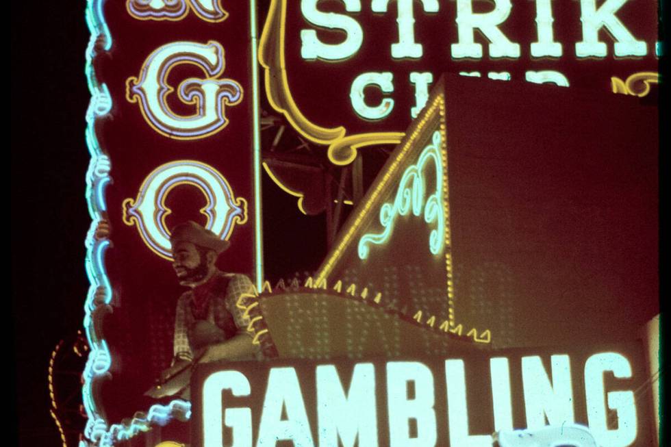 A prospector statue sits beneath the Lucky Strike Club sign on Fremont Street some time between ...