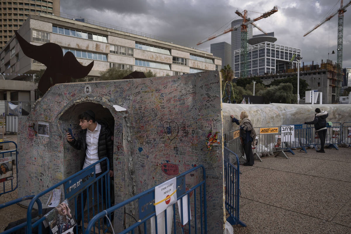 A man walks out from an installation simulating a tunnel in Gaza in an act of solidarity with h ...