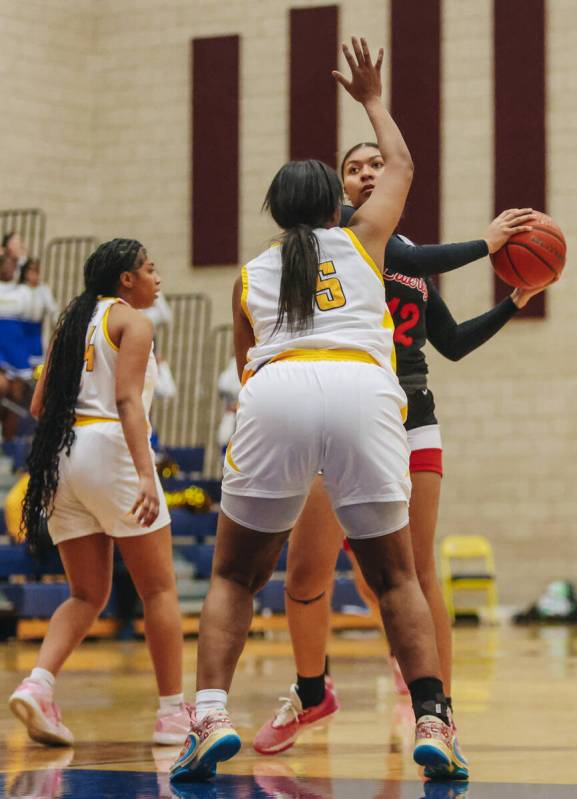 Liberty’s Daisha Peavy (12) keeps the ball in her possession as she eyes the basket duri ...