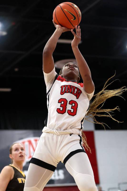 UNLV Lady Rebels guard Amarachi Kimpson (33) shoots against the Wyoming Cowgirls during the fir ...