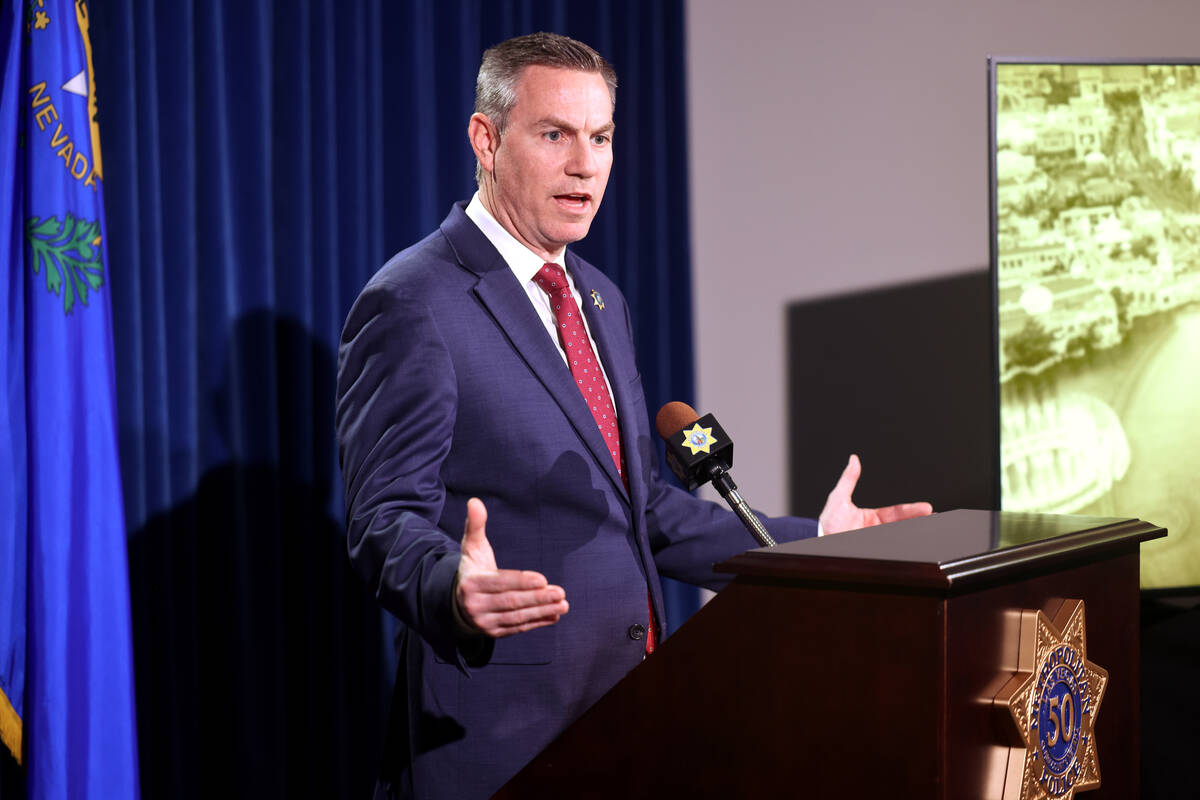 Homicide Lt. Jason Johansson answers a question during a press conference at Metropolitan Polic ...