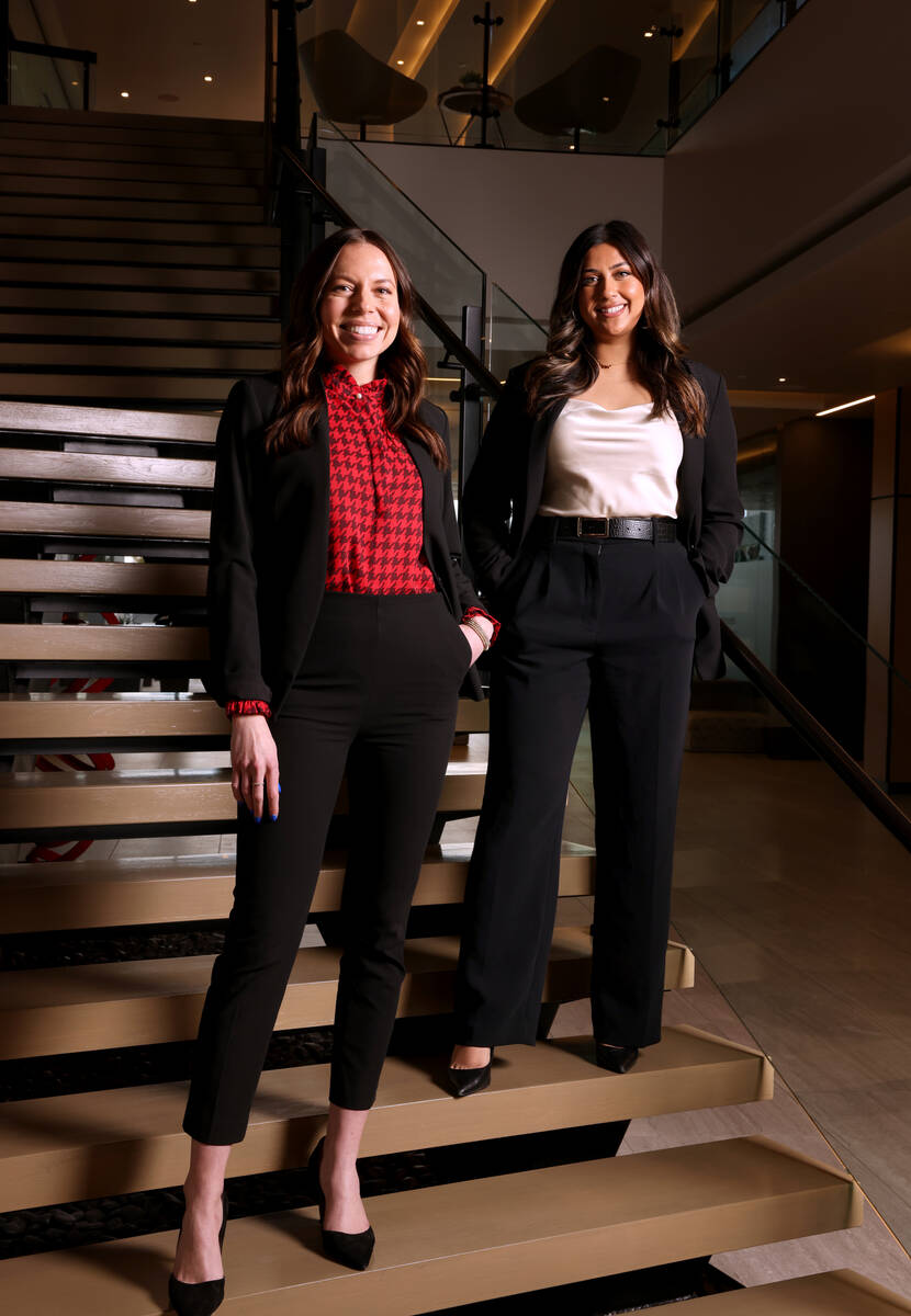 Commercial real estate brokers Megan McInerney, left, and Areeba Moten pose at Colliers Interna ...