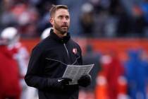 Arizona Cardinals head coach Kliff Kingsbury walks the field before an NFL football game agains ...