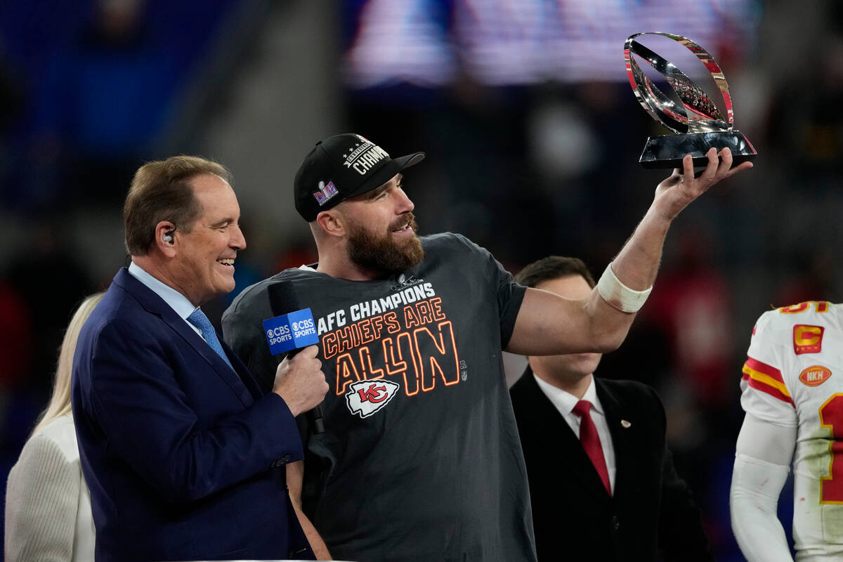 Kansas City Chiefs tight end Travis Kelce holds the Lamar Hunt trophy after an AFC Championship ...