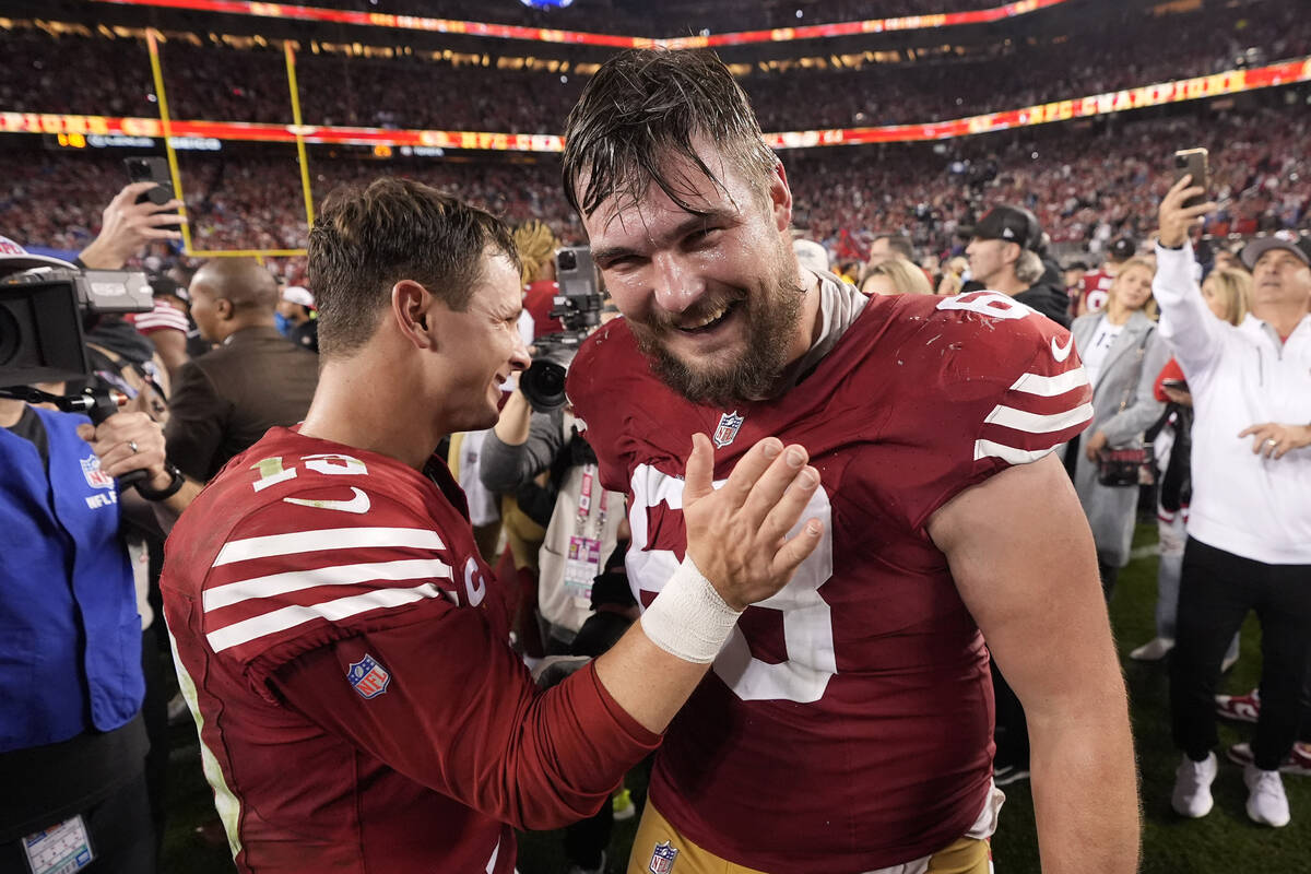 San Francisco 49ers quarterback Brock Purdy, left, celebrates offensive tackle Colton McKivitz ...