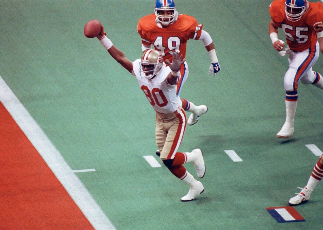 FILE - In this Jan. 28, 1990, file photo, San Francisco 49ers wide receiver Jerry Rice celebrat ...