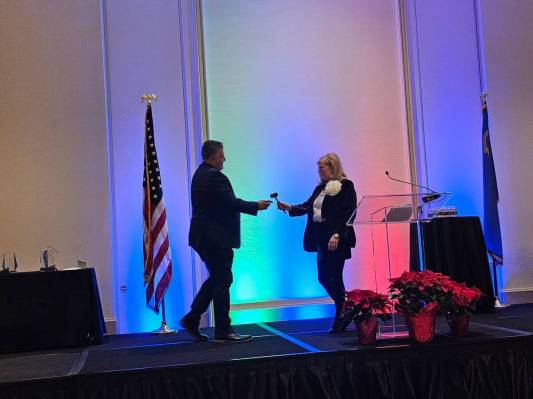 2024 SNHBA President Carlos Zuluaga accepted a ceremonial gavel from outgoing president Nicole ...