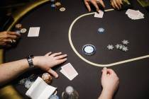 Guests play poker at the Aria hotel-casino in Las Vegas, Wednesday, Jan. 31, 2024. (Rachel Asto ...