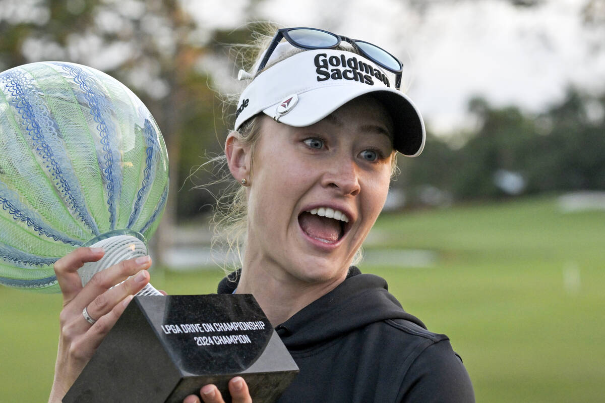 Nelly Korda holds the championship trophy after winning the LPGA Drive On Championship golf tou ...