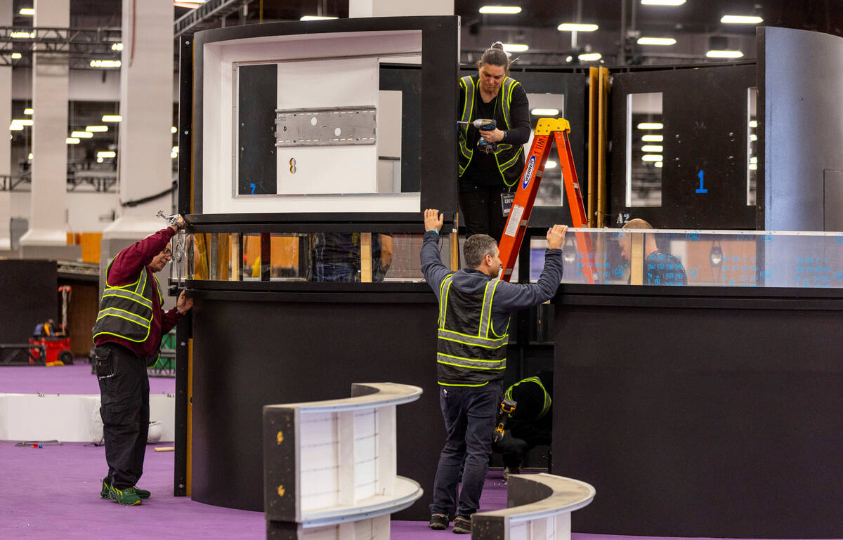 Booths are installed as set up continues for the Super Bowl Experience at the Mandalay Bay Conv ...