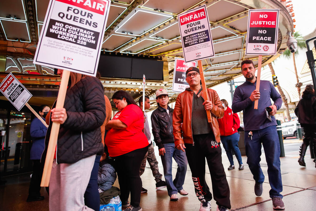 Members of the Culinary Local 226 picket outside the Four Queens Hotel & Casino on Friday, Feb. ...