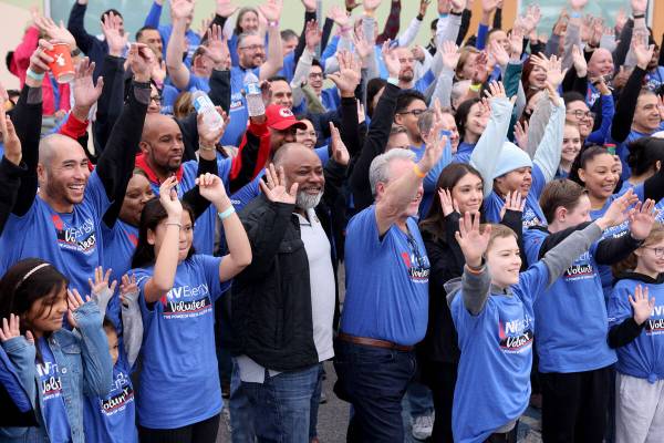 U.S. Attorney Jason Frierson, center front, poses with NV Energy volunteers during a service ev ...