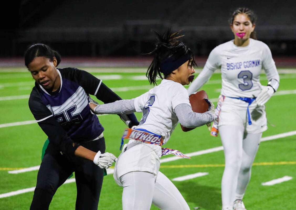 Shadow Ridge’s Jyniah Sanders (25) attempts to pull the flag off of Bishop Gorman’s Eden Am ...