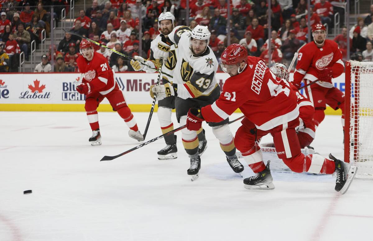 Detroit Red Wings defenseman Shayne Gostisbehere (41) clears the puck against Vegas Golden Knig ...