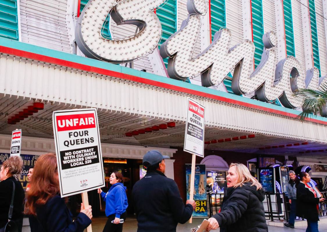 Members of the Culinary Union picket outside of Binion’s Gambling Hall & Hotel on Friday, Feb ...