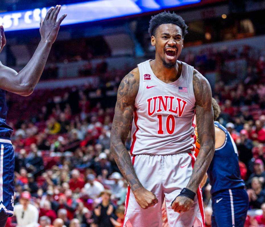 UNLV forward Kalib Boone (10) celebrates a big basket against Utah State Aggies forward Kalifa ...