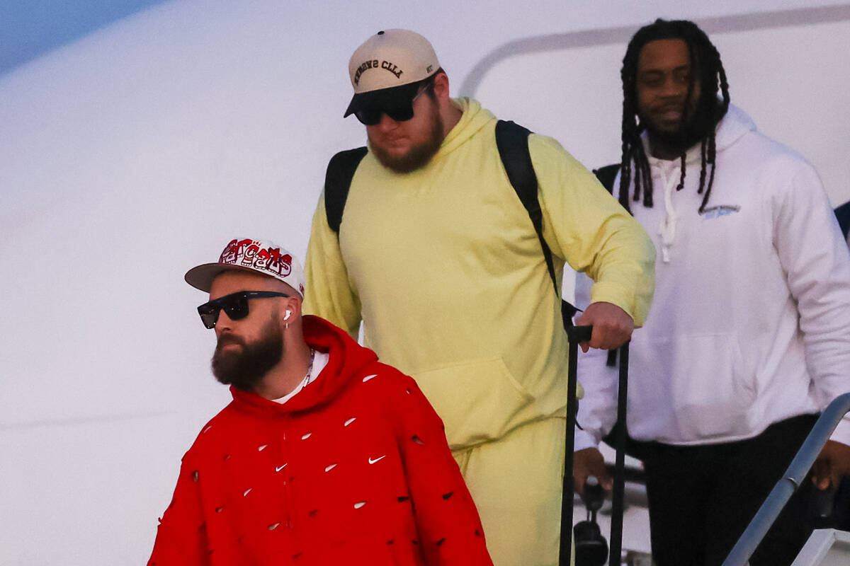 Kansas City Chiefs tight end Travis Kelce arrives at the Harry Reid International Airport along ...