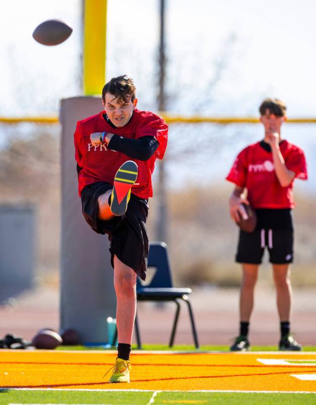 Kane Esposito of Las Vegas, a 14/15-year-old boy's contestant, kicks the ball during the Punt, ...