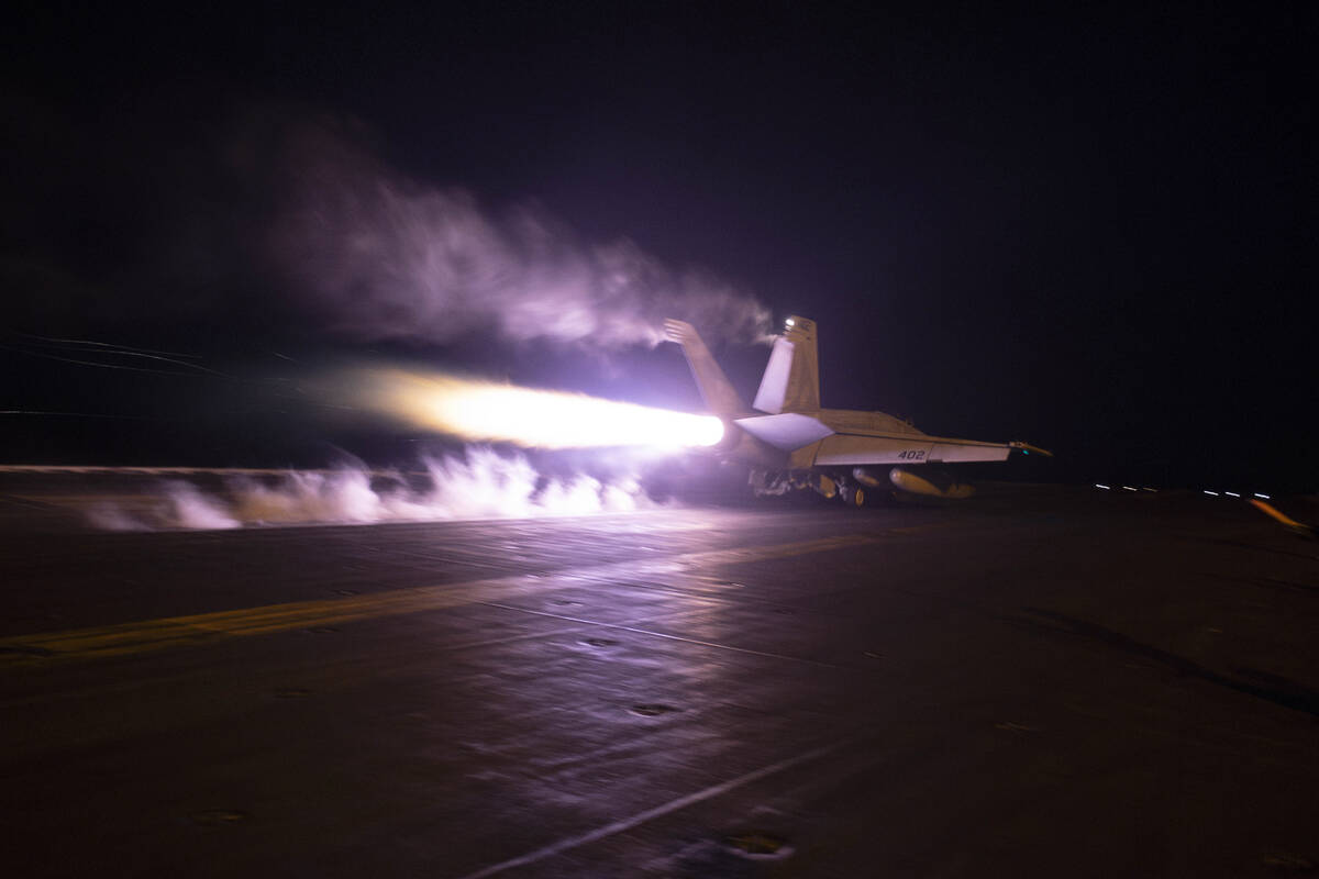 FILE - This image provided by the U.S. Navy shows an aircraft launching from USS Dwight D. Eise ...