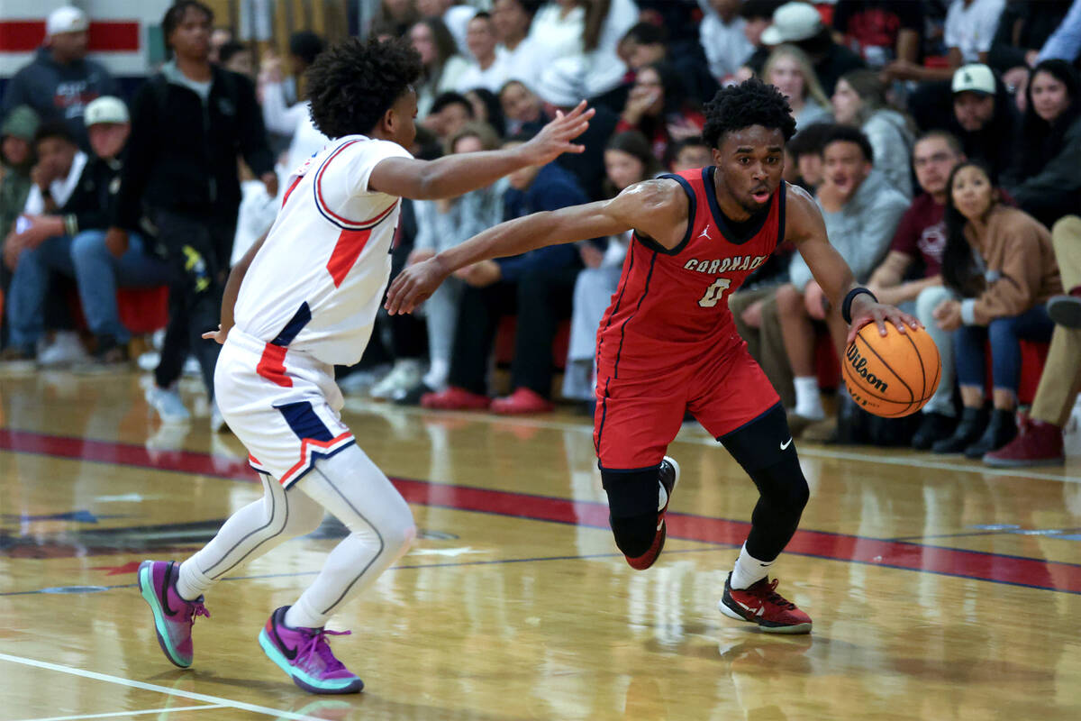 Coronado guard Jonny Collins (0) dribbles against Liberty guard Tyus Thomas (0) during the seco ...