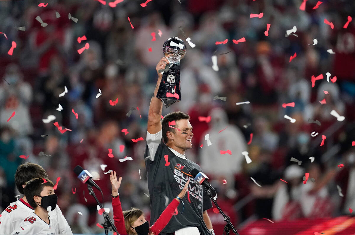 FILE - Tampa Bay Buccaneers quarterback Tom Brady holds up the Vince Lombardi trophy after defe ...