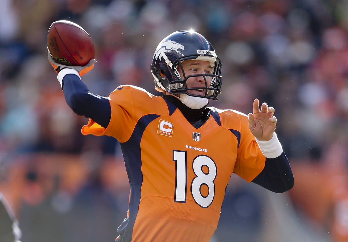 Denver Broncos quarterback Peyton Manning throws a pass in the first quarter of an NFL football ...