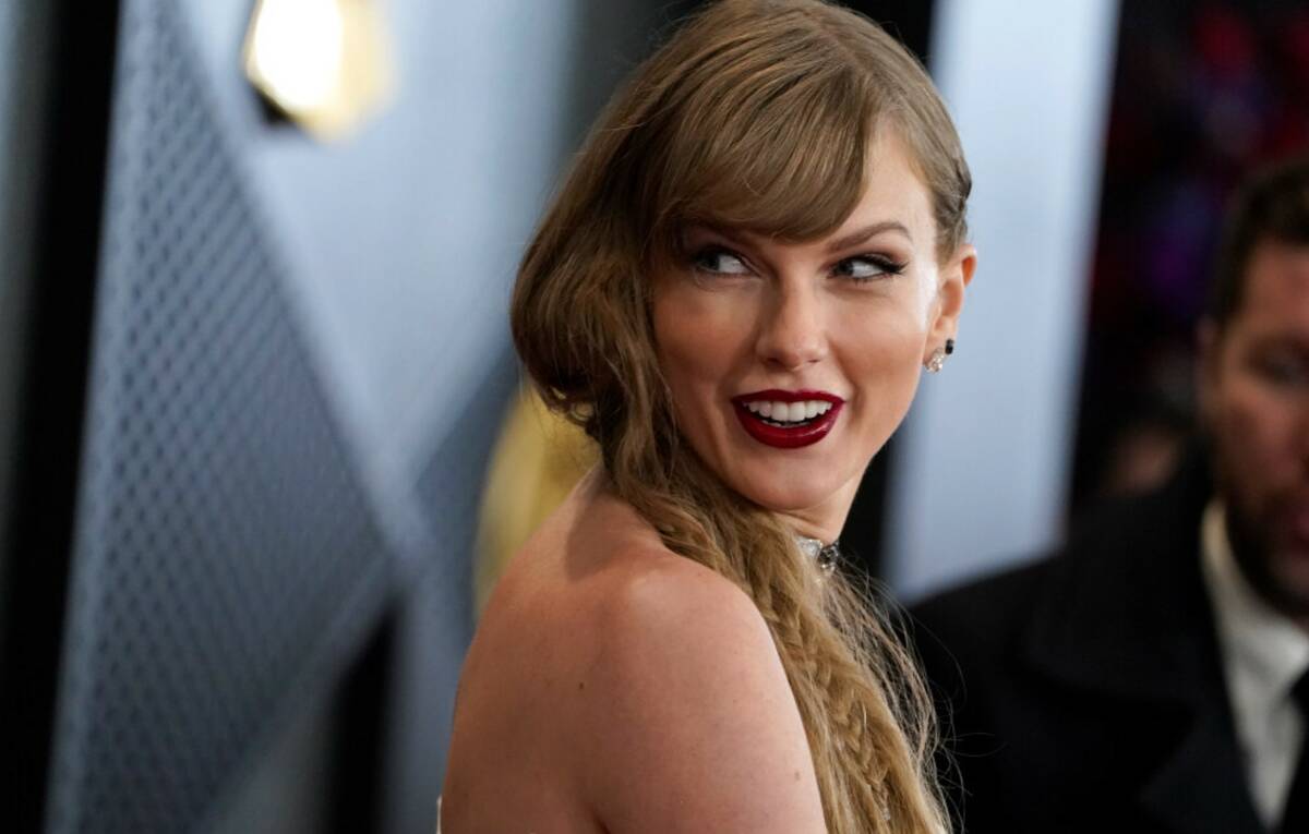 Taylor Swift arrives at the 66th annual Grammy Awards on Sunday, Feb. 4, 2024, in Los Angeles. ...