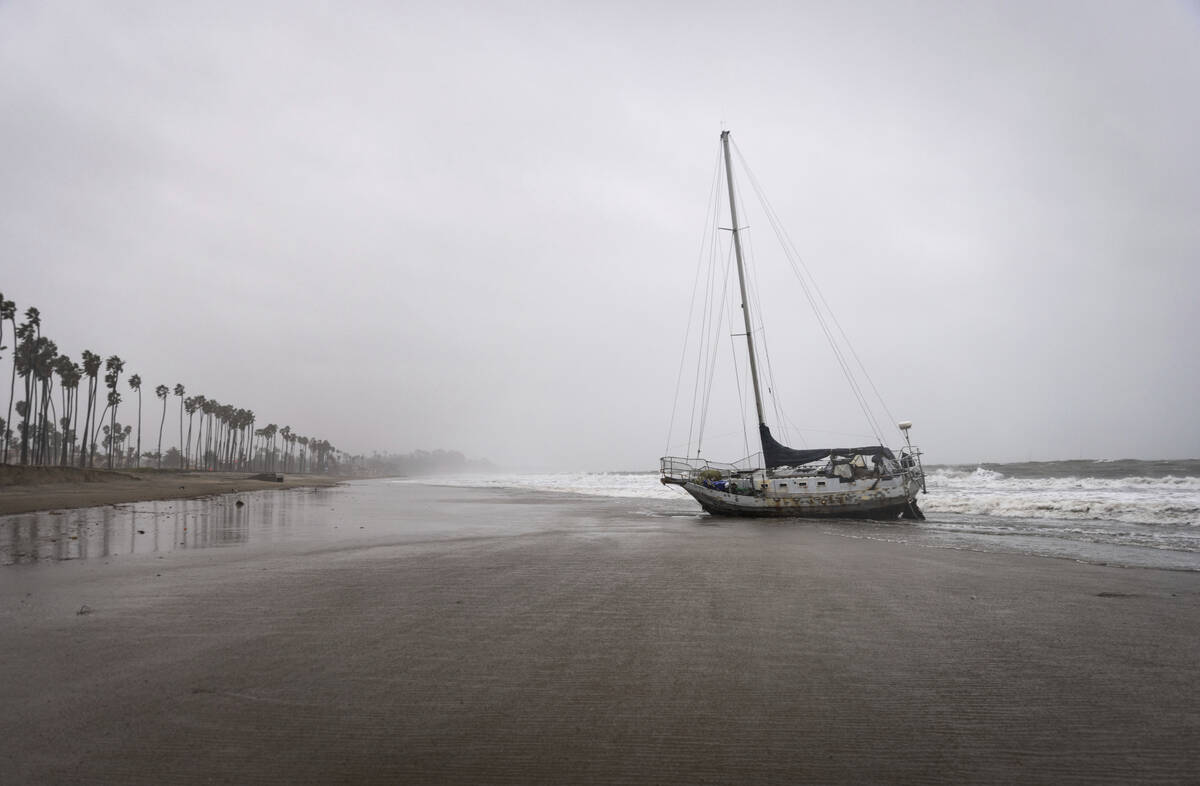 A drift boat washes ashore during a rainstorm, Feb. 4, 2024, in Santa Barbara, Calif. The secon ...