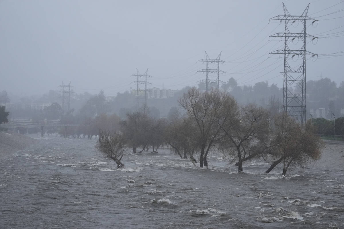 The Los Angeles River carries increased stormwater flow due to the atmospheric rivers affecting ...