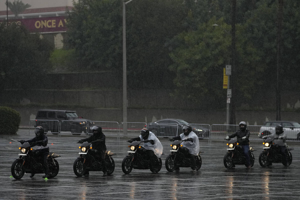 Riders line up under heavy rain during the California Motorcyclist Safety Program (CMSP) traini ...