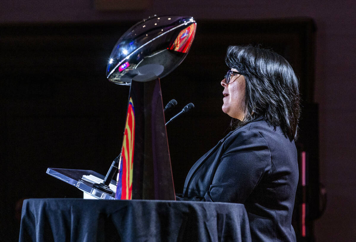 Las Vegas Paiute Tribe Chairwoman Deryn Pete greets the crowd beside the Lombardi Trophy as the ...