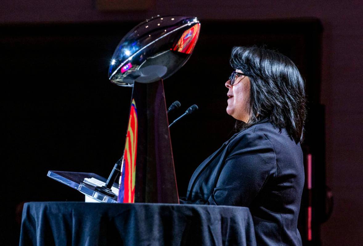 Las Vegas Paiute Tribe Chairwoman Deryn Pete greets the crowd beside the Lombardi Trophy as the ...