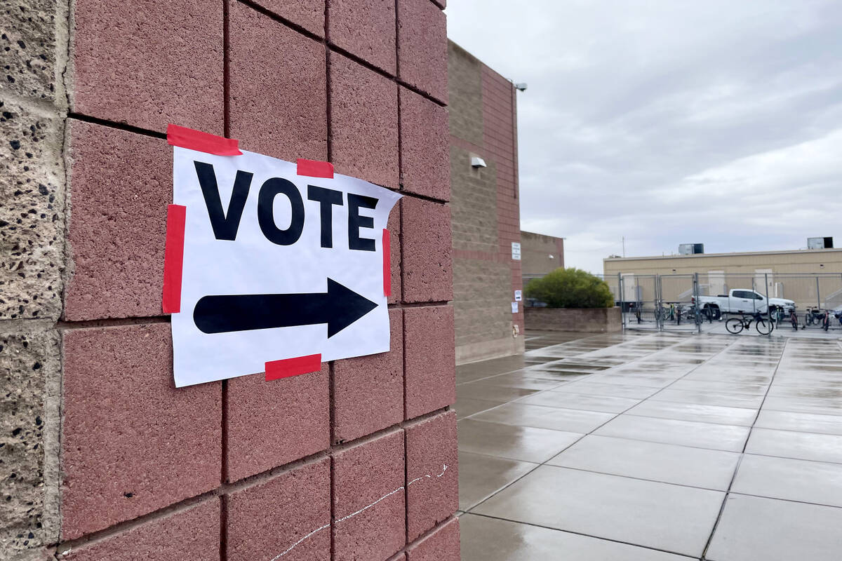 A sign directs primary voters at Bob Miller Middle School Tuesday, February 6, 2024, in Henders ...