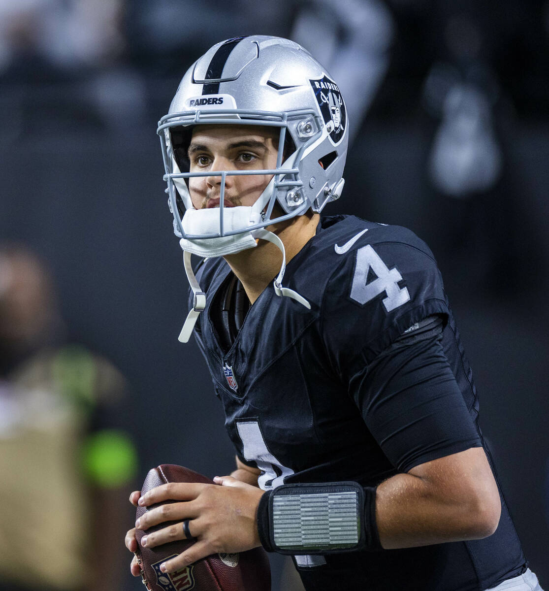 Raiders quarterback Aidan O'Connell (4) looks to pass during warmups before the first half of t ...