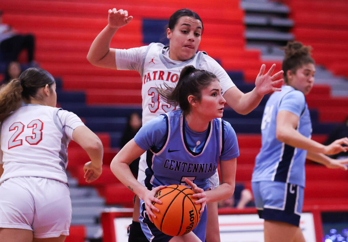 Centennial’s Trysta Barrett (5) looks to take a shot around Liberty’s Leiliani Ha ...