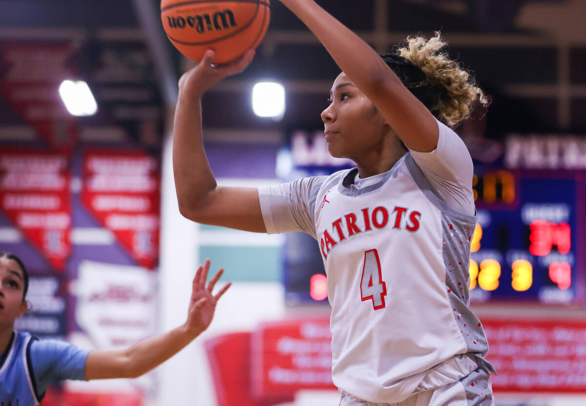 Liberty’s Satsuki Bradley (4) shoots a three pointer during a basketball game between Li ...