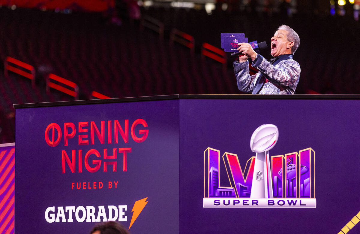 Announcer Bruce Buffer brings on the Kansas City Chiefs to the field during the Super Bowl Open ...