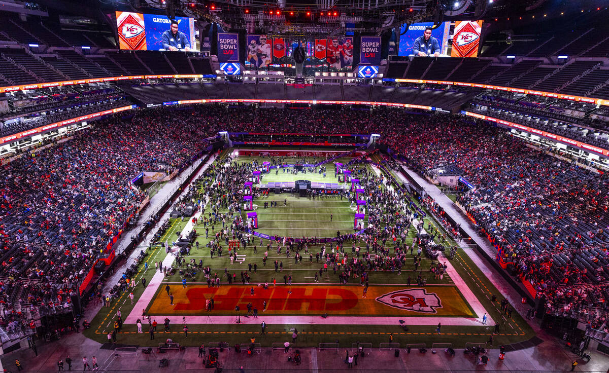 Fans, guests and media members fill the stands and field as Kansas City Chiefs players and coac ...