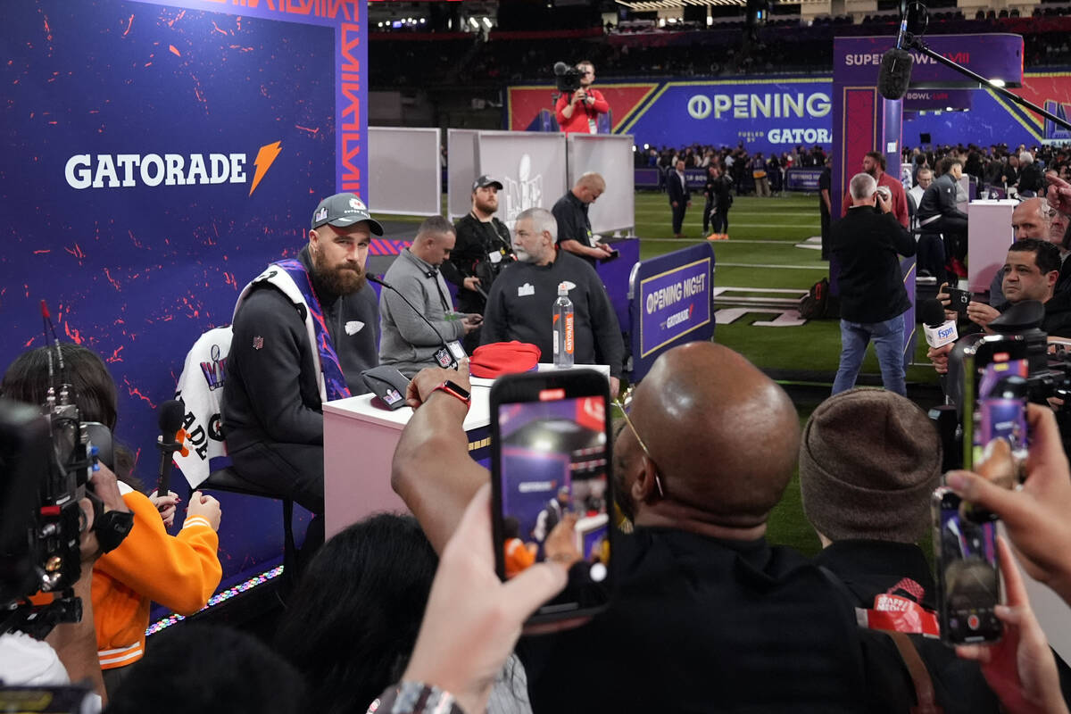 Kansas City Chiefs tight end Travis Kelce, left, participates in the NFL football Super Bowl 58 ...