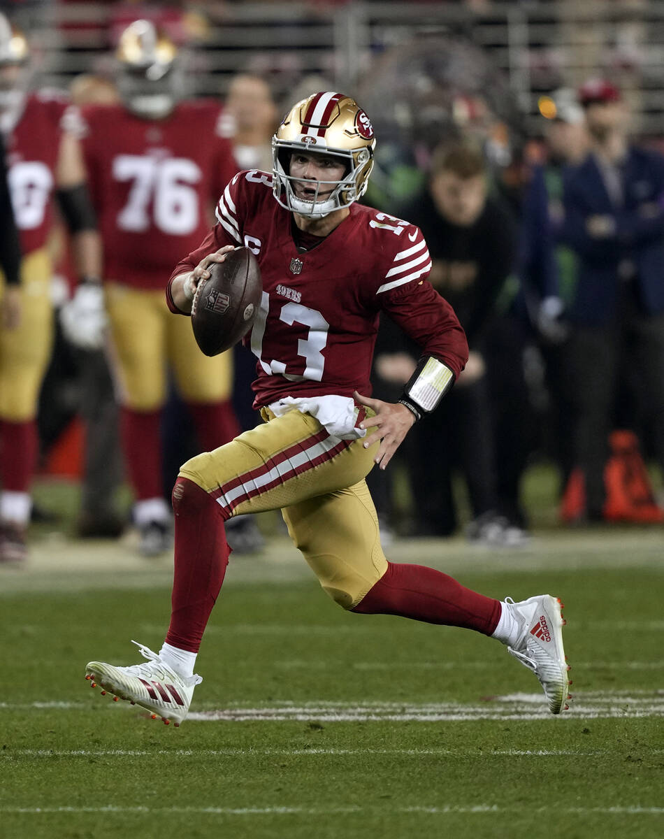 San Francisco 49ers quarterback Brock Purdy (13) runs up the field during the NFC Championship ...