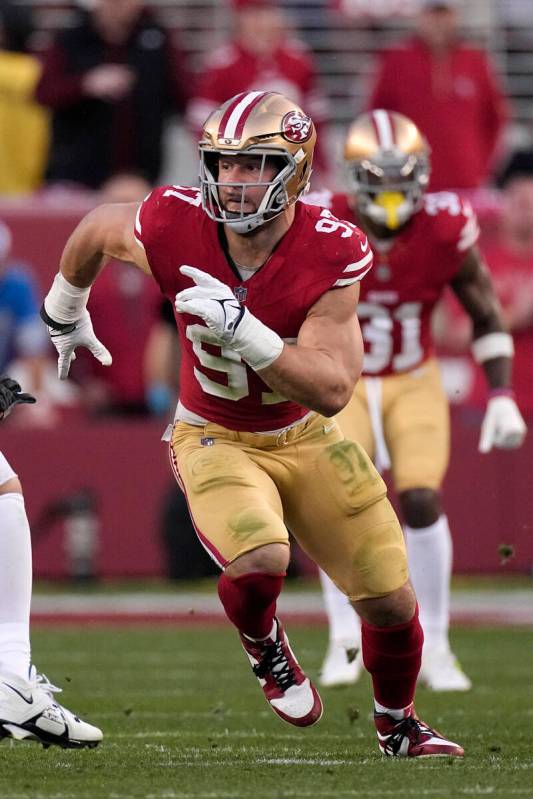 San Francisco 49ers defensive end Nick Bosa rushes toward the ball during the first half of the ...