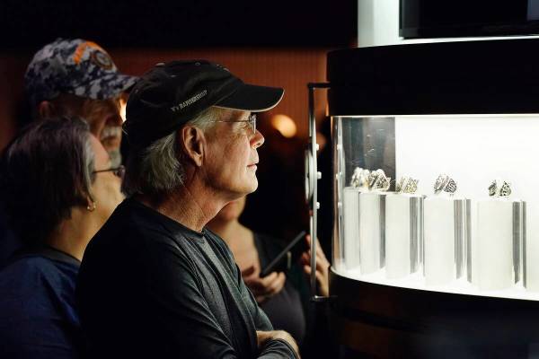 People check out all the Super Bowl championship rings at the Super Bowl Experience, the openin ...