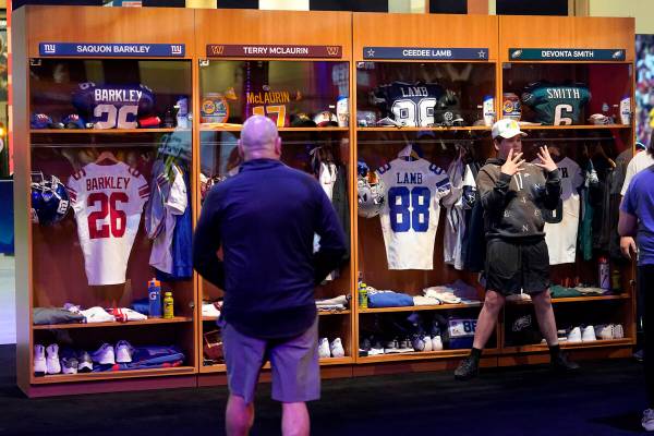 NFL football fans participate in the Super Bowl Experience, Saturday, Feb. 4, 2023, in Phoenix. ...