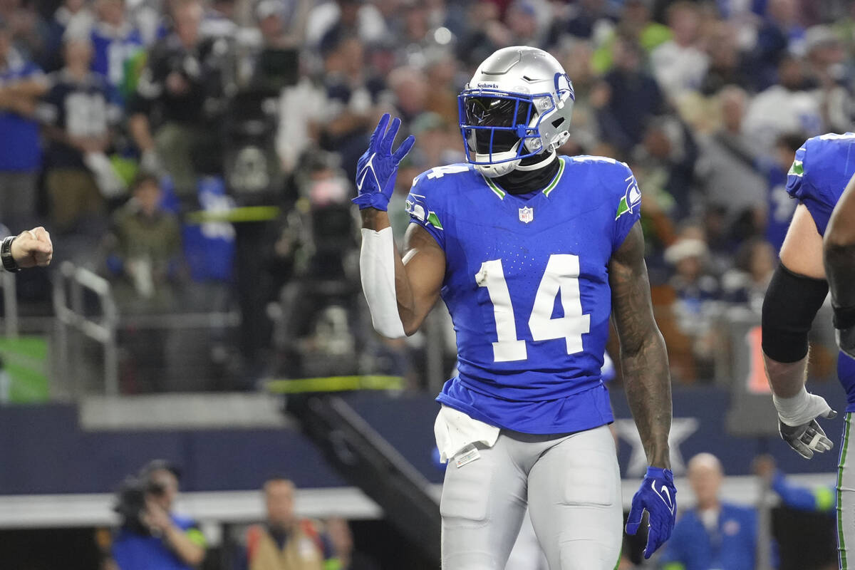 Seattle Seahawks wide receiver DK Metcalf (14) celebrates one of his touchdowns during an NFL f ...