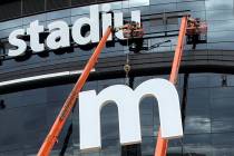 The last letter in the signage for the Raiders Allegiant Stadium logo is installed, in Las Vega ...